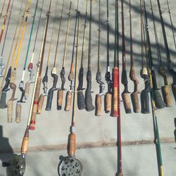 35 VINTAGE FISHING POLES AND  A FEW RpEELS