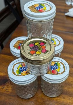 Brand new glass jars for jelly or sauces ( never used ).
