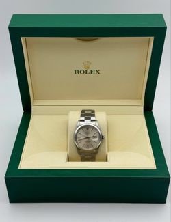 Rolex OysterDate 34mm stainless steel oyster bracelet smooth bezel silver stick dial 1500 watch box tag appraisal