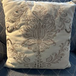 10. Throw pillow with intricate design.