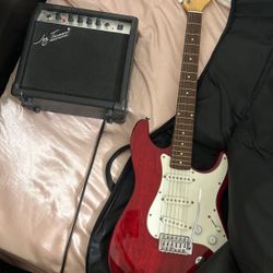 Red Electric Guitar With Amplifier 