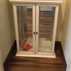 White display case with glass dividers