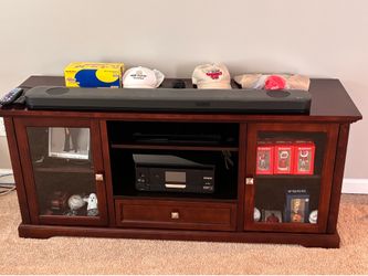 Tv stand.  Cherry wood   Made well. Real wood not pressboard