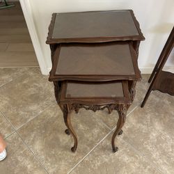 Antique stackable tray tables with a glass top