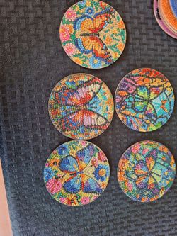 5 completed butterfly diamond art coasters