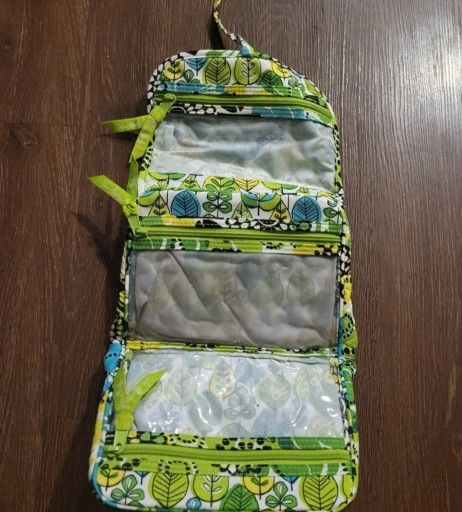 Vera Bradley cosmetic bag closed 8" wide, 6.5" high. Open 18" long