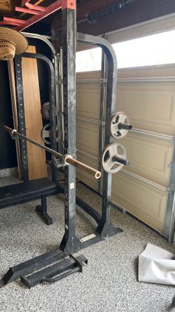 Squat rack with bench and plates