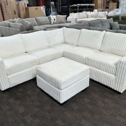 White Corduroy Sectional And Ottoman 