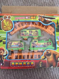 Green toy train set with tracks