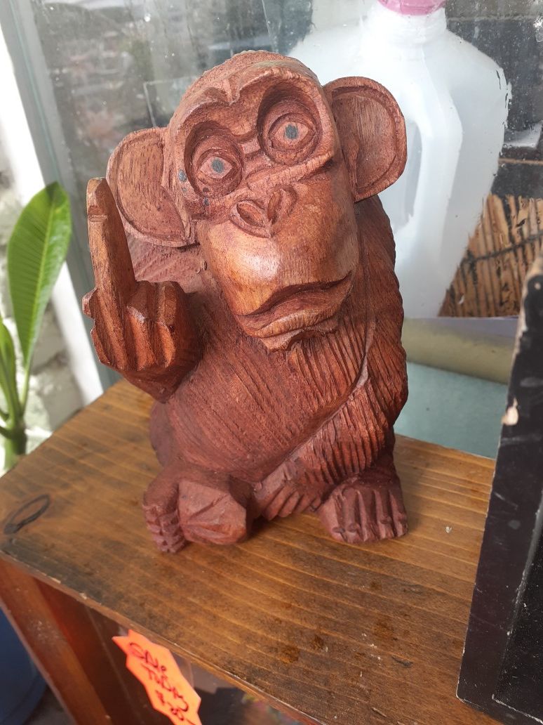 Cute little carved wooden flipping monkey
