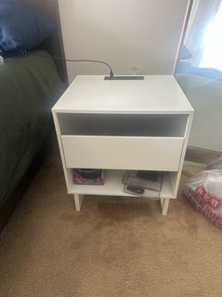 white nightstand with charging outlet