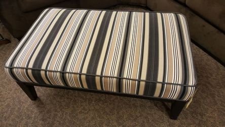 Floor model close out cocktail ottoman
