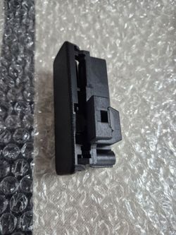 Glove box opener handle for Nissan Versa
