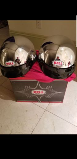 Two new chrome motorcycle helmets