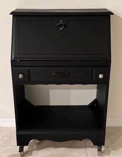 Rolling wine cabinet Underneath holds the glasses