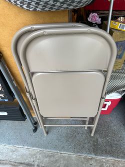 2 metal folding chairs