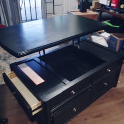 Coffee Table With Lift Top On Sturdy Wheeled base.