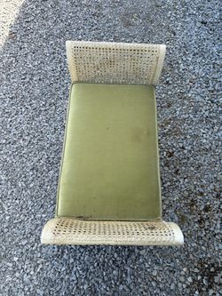 Small vintage bench with green cushion