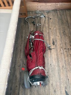 Set of Eleven Golf Clubs with Red Cart Bag and Push Cart