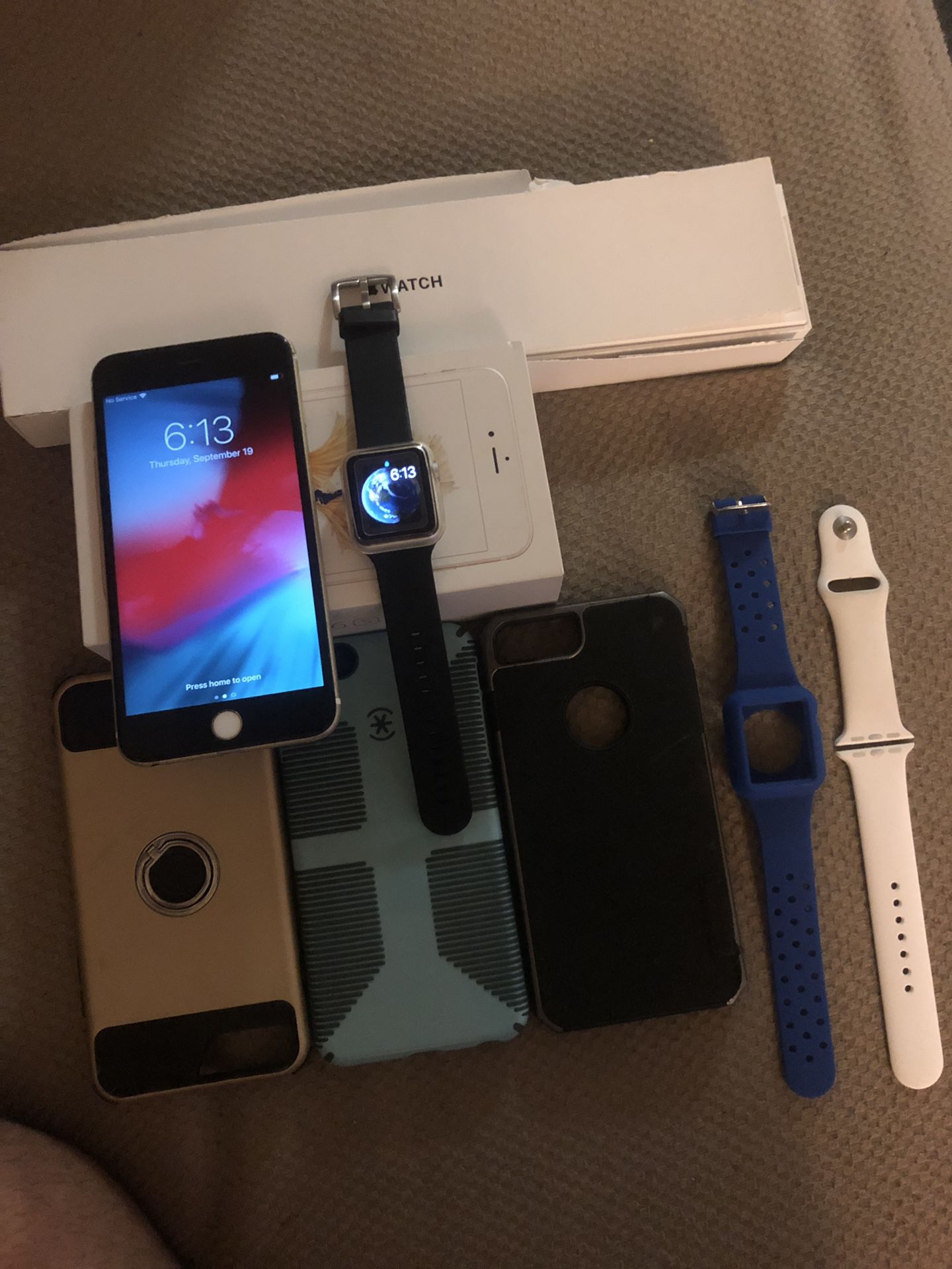 iphone 6s plus with apple watch series 1 and cases
