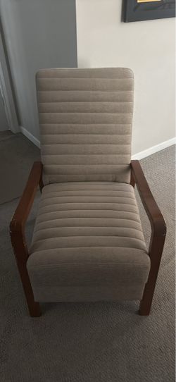 Designer reclining chair with footrest