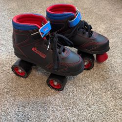 Chicago brand kids’ quad roller skates, black with red stitching and wheels.