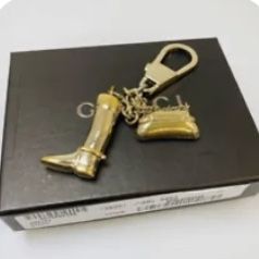Original Boxed Gucci gold purse charm/keychain in great condition