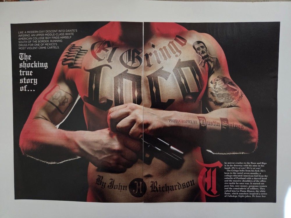 The image is a magazine spread featuring a man with tattoos on his torso and arms, holding a handgun