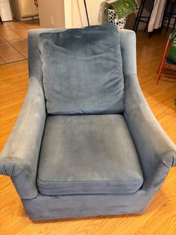 This is a blue velvet swivel accent chair, like the Madison Park Deanna Swivel Arm Chair or Madison Park Morton Blue Velvet Fabric S