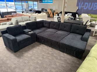 Large black sleeper storage sectional
