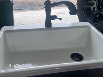 Used Kohler white over mount farm sink with faucet