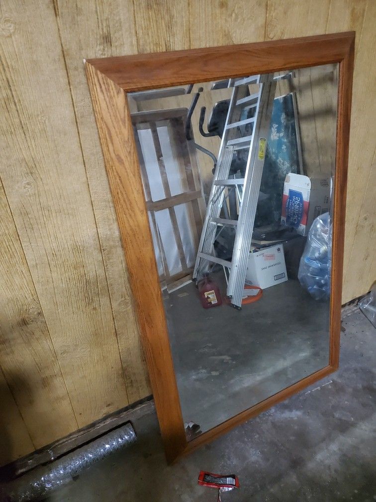 Large mirror in wood frame