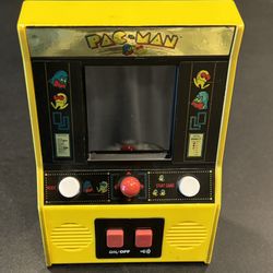 Pac-Man Color Arcade Classics LCD Retro Mini Arcade Game, Yellow- Tested. Clean battery compartment. Requires 3 AA batteries not included.