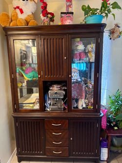 Brown cabinet for plates, any decor
