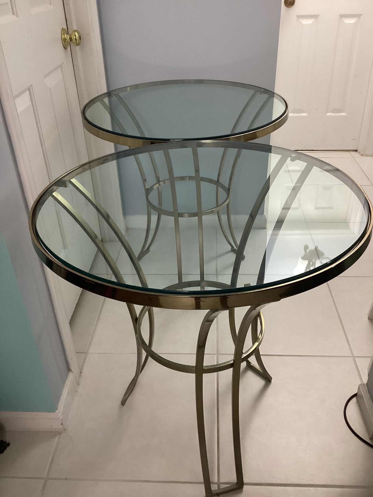 A Pair Of Beautiful Round Tables With Thick Glass Measurements: 27.5 W X 27”height Asking $200. Both