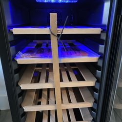 Brand New 18 Bottle Wine Fridge With Blue Interior Lighting And Wood Rack