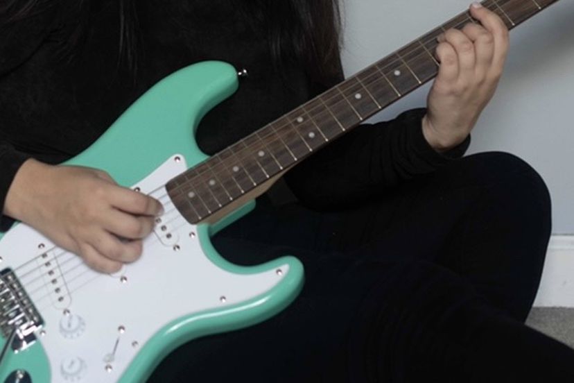 Turquoise fender 6 String guitar