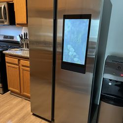 Stainless Steel Samsung Refrigerator W/ Built In Tv