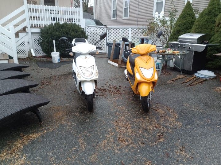 White Amigo Beemer And Yellow Wolf Mopeds