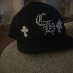 CH hat with crosses all around 