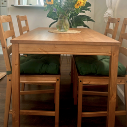 IKEA pine dining table with 4 chairs and seat cushions