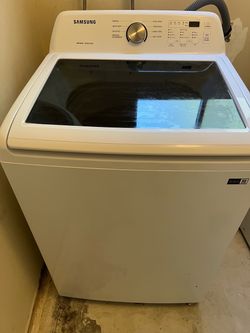 Top load washer and gas dryer