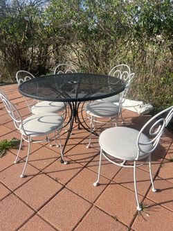 Wrought iron table and 6 chairs