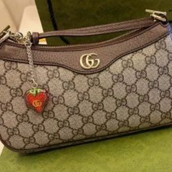 OPHIDIA WOMEN’S SMALL BROWN/BEIGE SHOULDER BAG WITH STRAWBERRY CHARM AND TWO STRAPS 