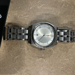 Silver NIXON Monopoly Watch