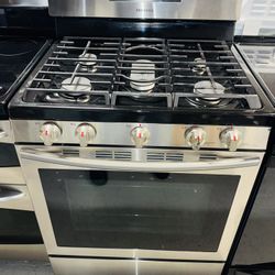 Samsung stainless steel electric stove with a receipt for a 90-day warranty