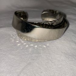  a Stella & Dot silver-tone cuff bracelet. 