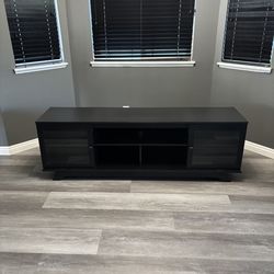 Black Entertainment Center with Glass Doors and Adjustable Shelves