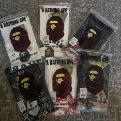 BAPE black t-shirt with multi coloured print.