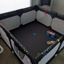 It's 59 by 59 and 27 inches tall Play Pen 